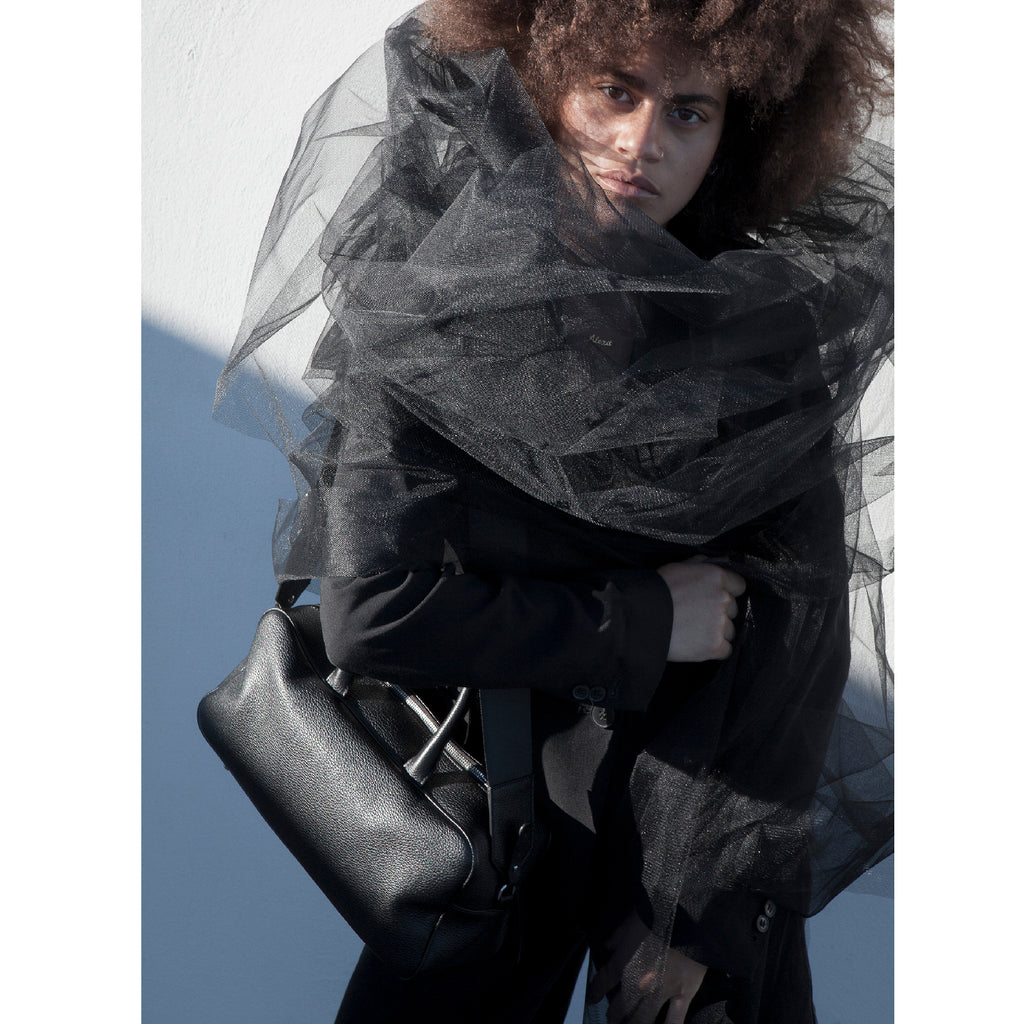 Shoulder Satchel Bag in pebble grain leather. Carry with the top handles or over the shoulder as a cross-body using the adjustable fabric strap. The width and length makes it spacious to carry most essentials, even a 10" iPad will fit cross diagonally.